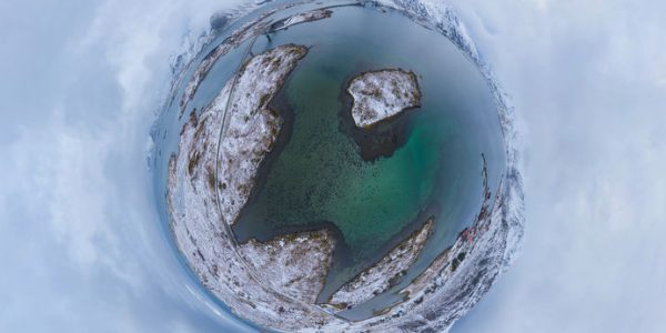Little planet 360 degree sphere. Panorama of aerial view of white snow mountain in Lofoten islands, Nordland county, Norway, Europe. Nature landscape in winter. Nature landscape background.