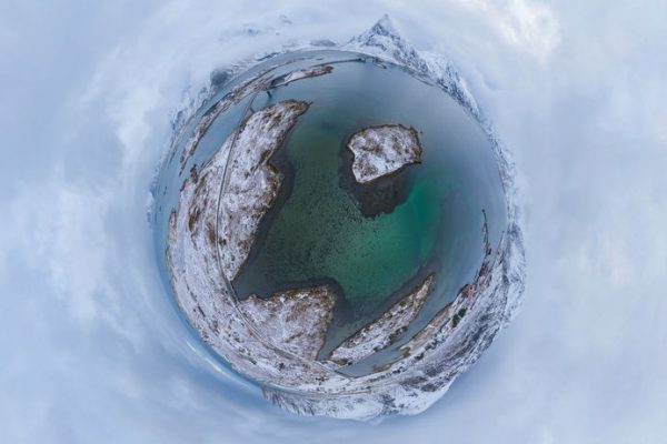 Little planet 360 degree sphere. Panorama of aerial view of white snow mountain in Lofoten islands, Nordland county, Norway, Europe. Nature landscape in winter. Nature landscape background.